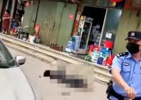 河南一男子持刀伤人后跳楼身亡 周围有警方拉起的警戒线