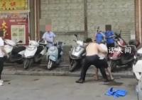 广西一城管将小贩抱起扔倒在地 已被停职