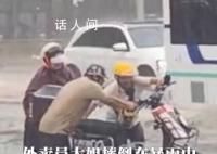 大哥冲入暴雨中救援被困女外卖员 为两位热心市民点赞